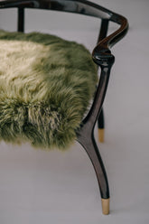 The ARCHED BACK Bench - Sculptural black lacquered wood frame with moss green fur upholstery by Ali Khan Studio
