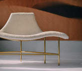 The Verona Chaise - A glamorous white statement chair with gold legs by Ali Khan Studio