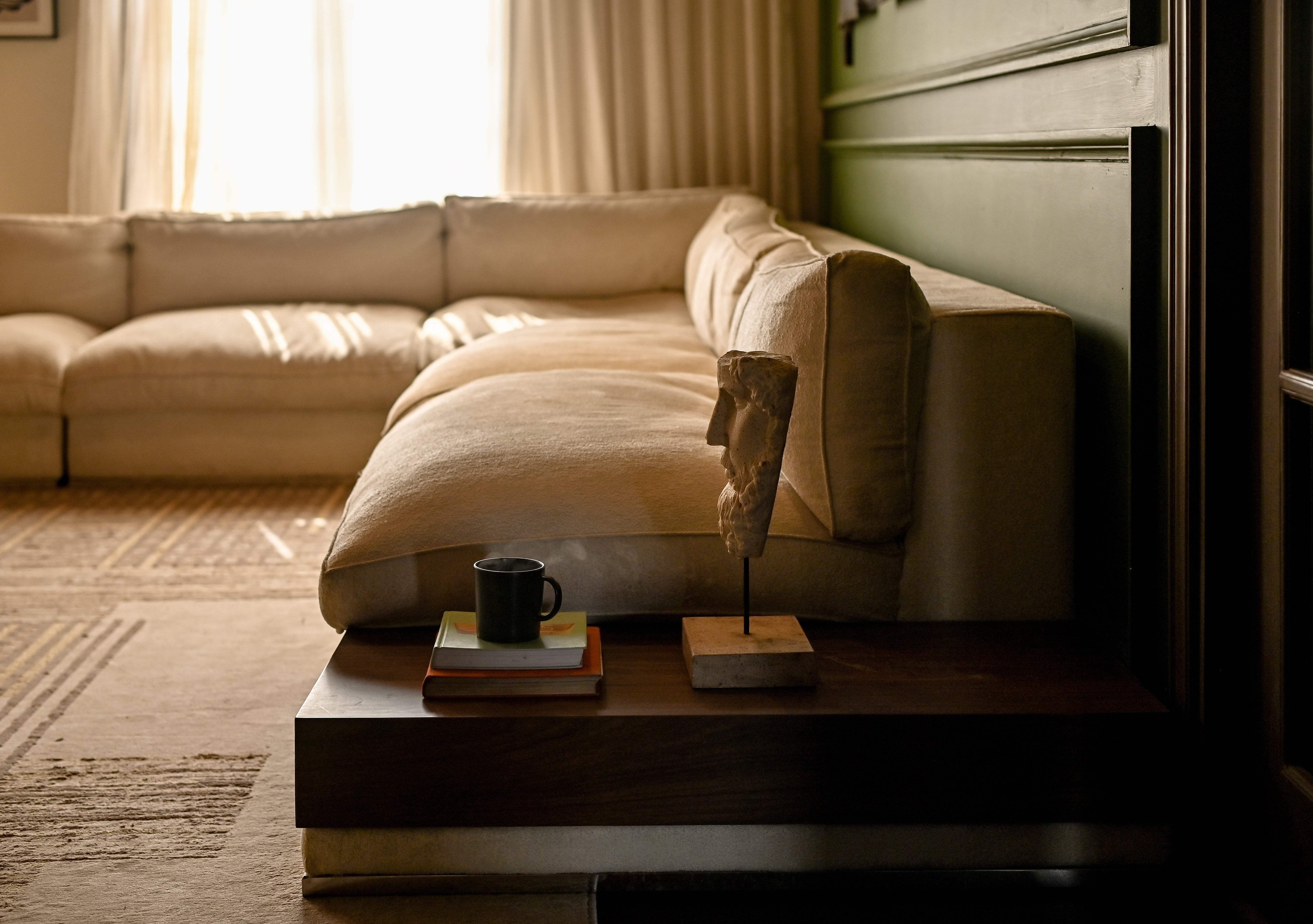 Cloud L-Shape Down-Feather Sofa in a cinematic sanctuary interior by Ali Khan Studio Karachi Pakistan