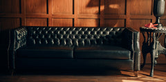 Close-up of the deep button tufting and classic rolled arms on the NOIR Chesterfield Sofa