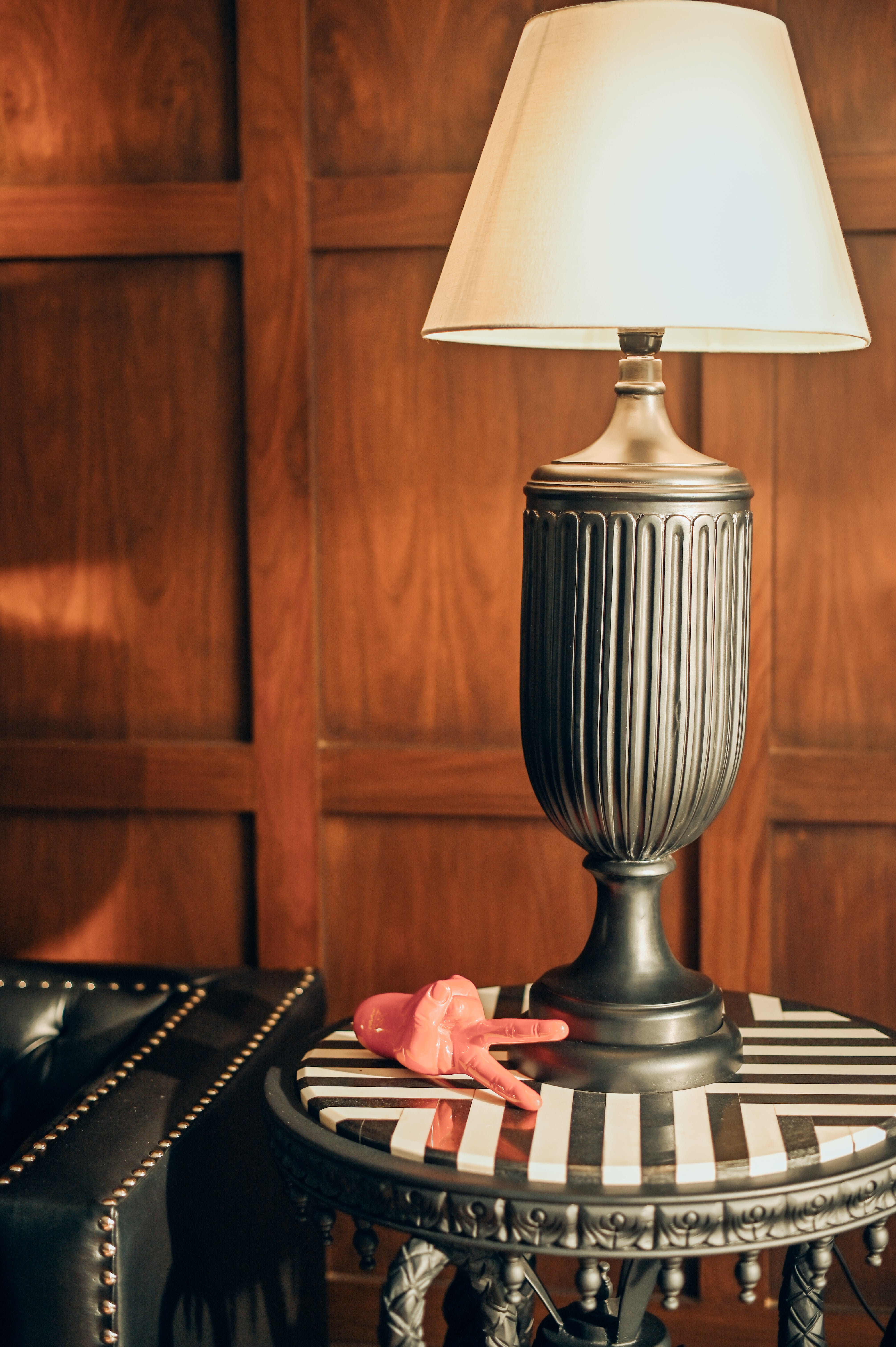 NIGHT TALK Lamp - A glamorous black fluted table lamp styled on a striped console by Ali Khan Studio