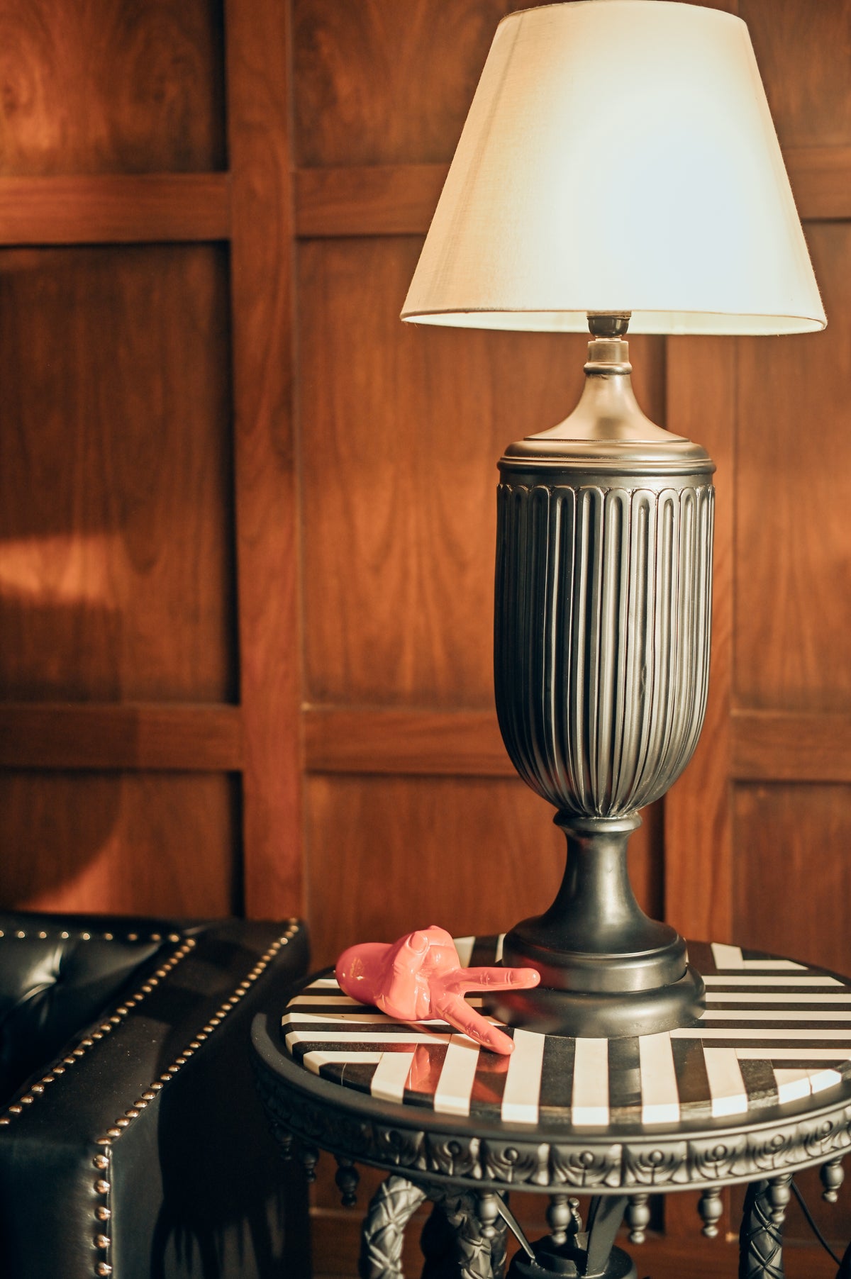 NIGHT TALK Lamp - A glamorous black fluted table lamp styled on a striped console by Ali Khan Studio